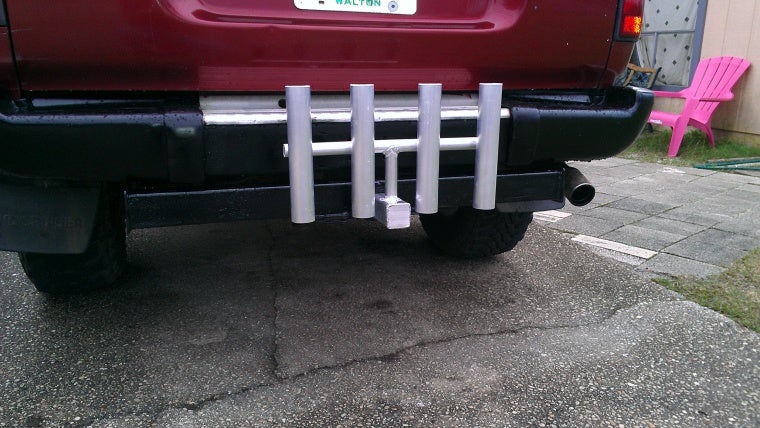 a set of hitch mounted rod holders for suvs or trucks